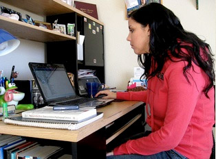 students studying on computer at home